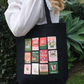 Burning Through Chapters Canvas Gusseted Tote Bag in Black